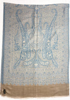 Decorative fabric with intricate blue paisley pattern on a white background