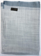 Gray checkered fabric with a label on a white background