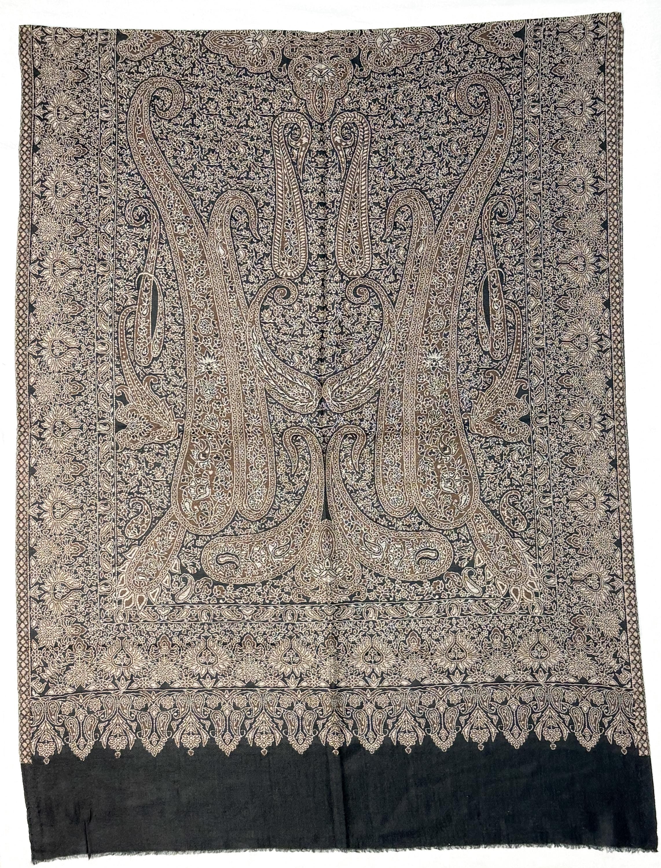 Decorative scarf with intricate paisley pattern on a plain background