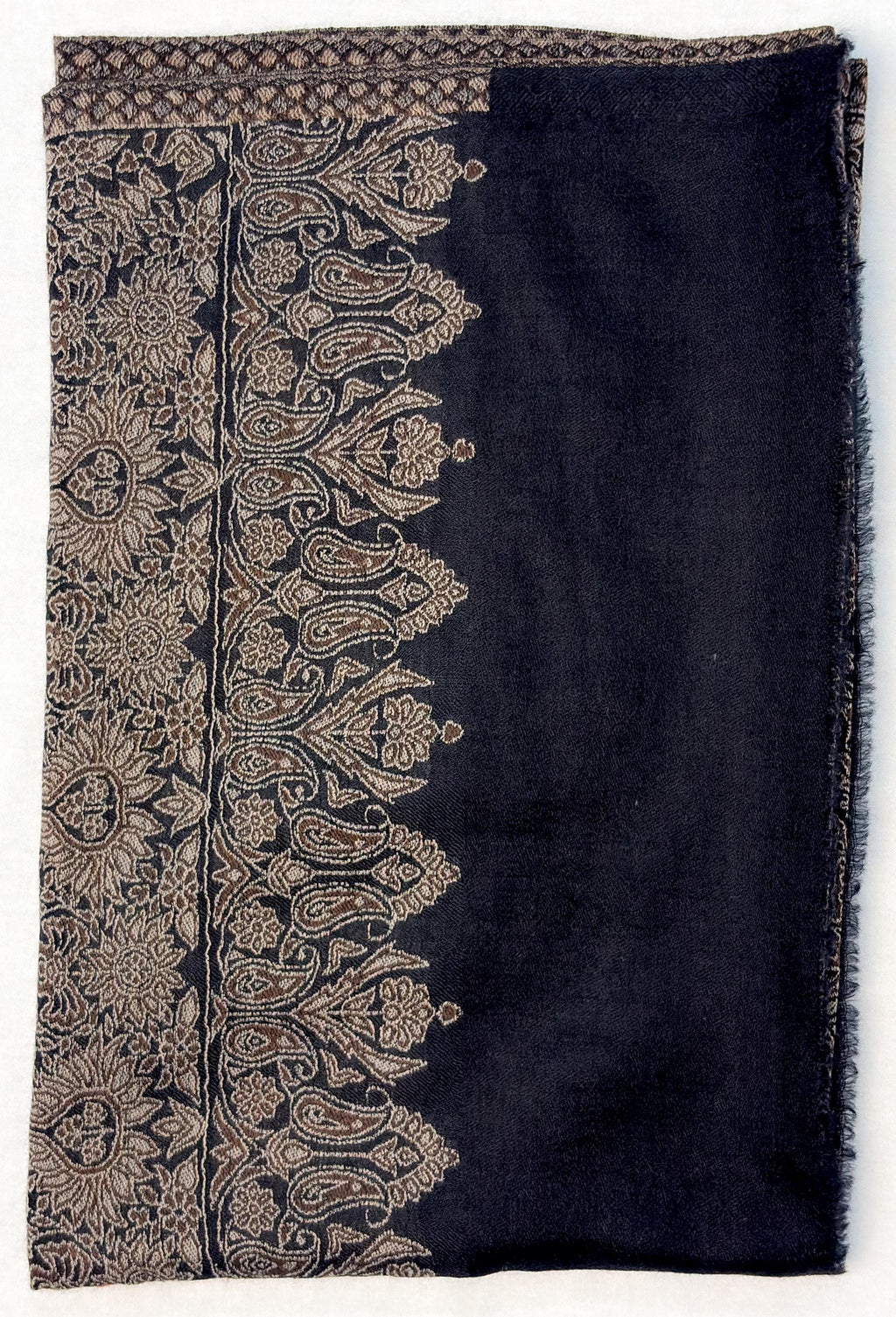 Black scarf with intricate beige paisley patterns on a white background