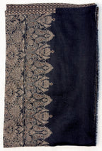 Black scarf with intricate beige paisley patterns on a white background