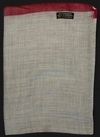 Gray fabric with red border and 'Dry Clean Only' label on a black background