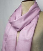 Light purple scarf on a mannequin against a neutral background