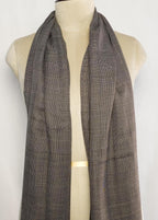 Plaid scarf on a mannequin against a white background