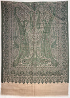 Decorative fabric with intricate green and beige pattern on a plain background