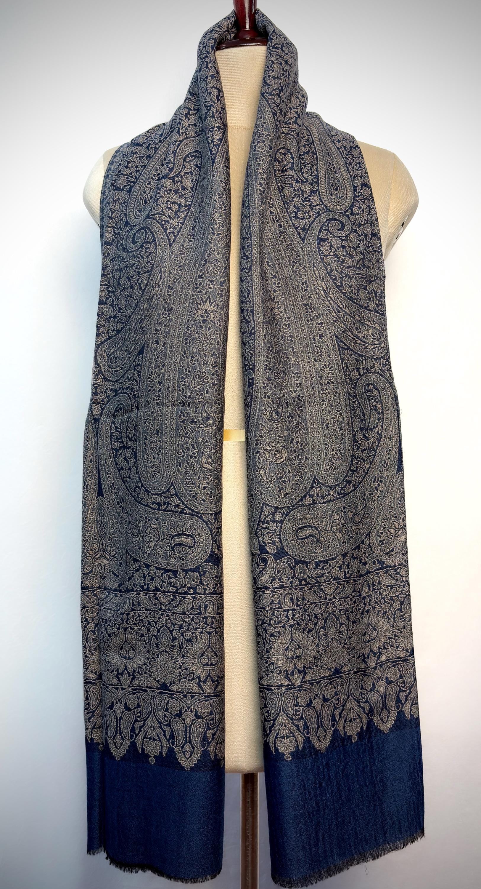 Paisley patterned scarf on a mannequin against a white background