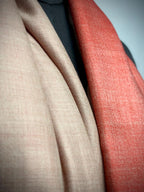 Close-up of beige and red fabric swatches.