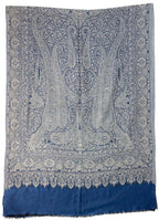 Blue and white patterned fabric with a prominent design on a white background